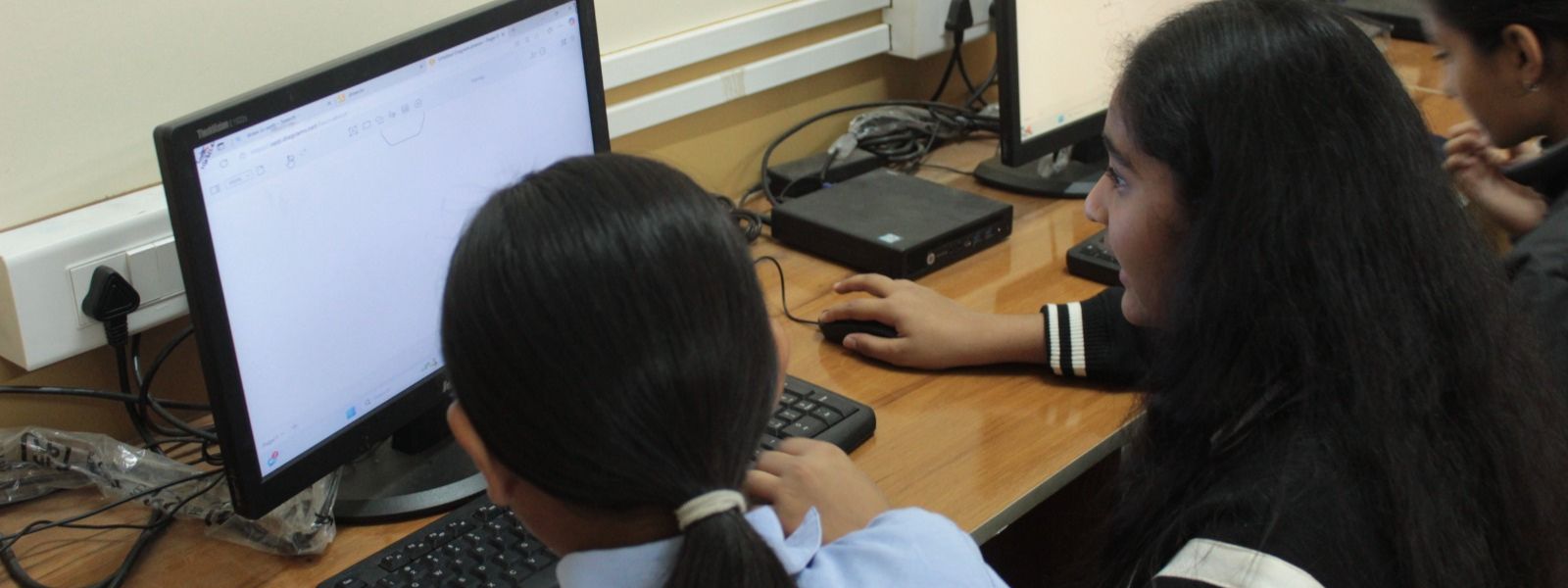 students using computers in the lab at podar education school