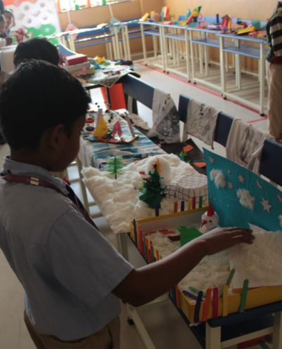 students engaged in practical experiments in the science lab at podar education school