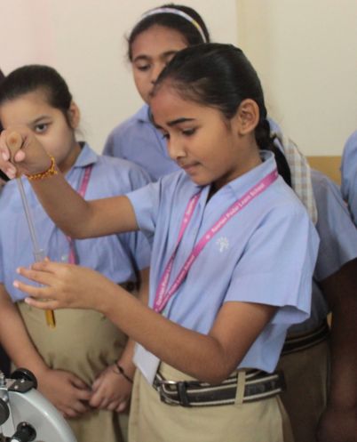 students collaborating in the computer lab at podar education school