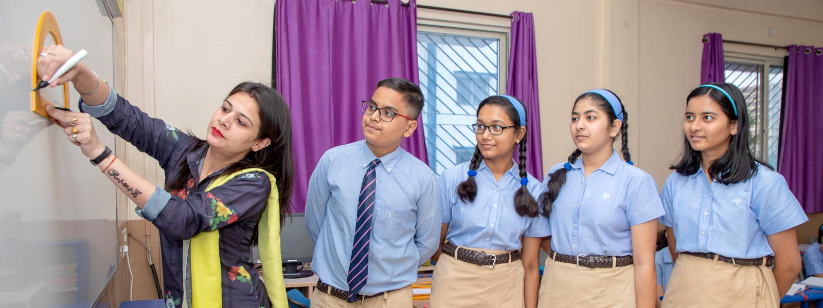 podar education school students receiving academic guidance for grades 11 and 12