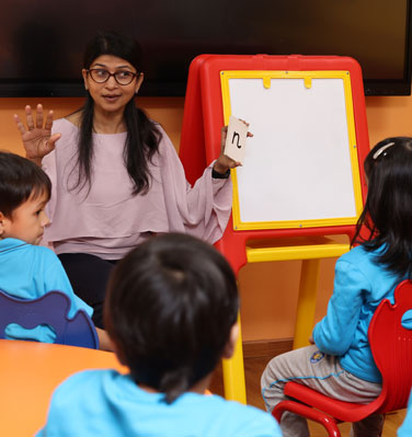 mobile view of students participating in the symphonics music program at podar education school